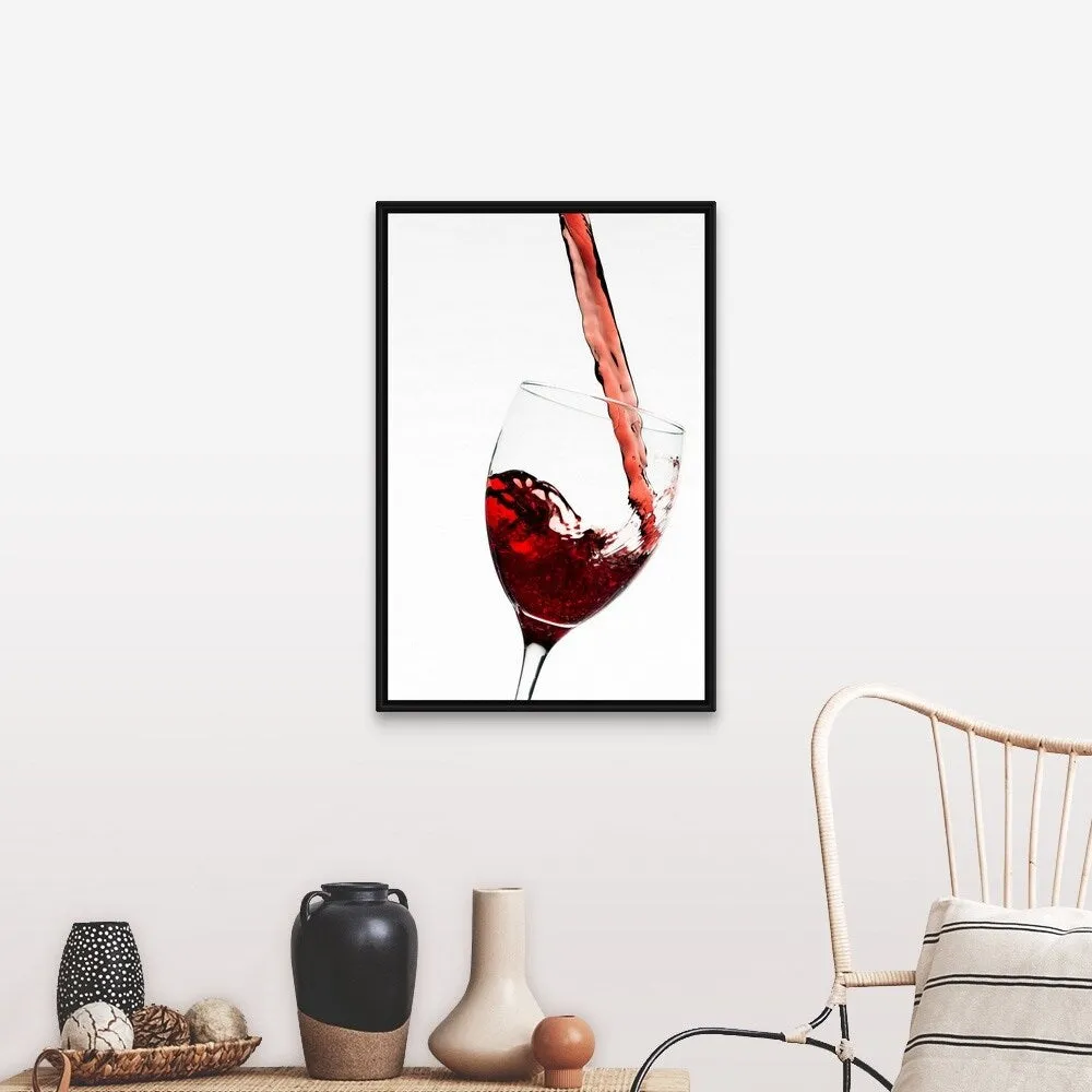 "Close up of red wine being poured into glass on white background" Black Float Frame Canvas Art